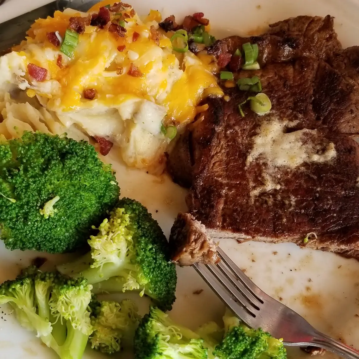 Rib Eye Steak Loaded Mashed Potatoes and Steamed Broccoli
