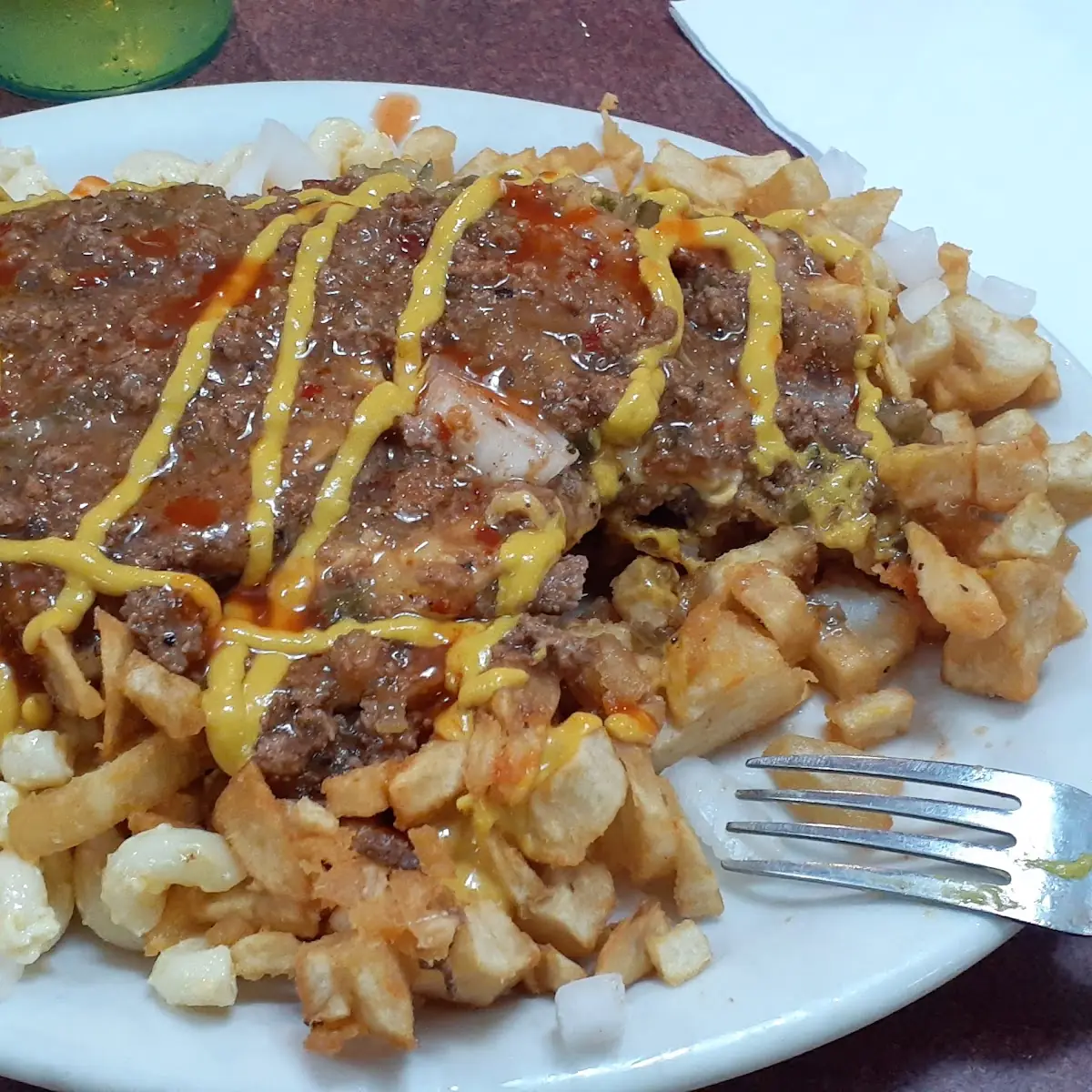 Messy Plate with 2 Cheeseburgers on Top
