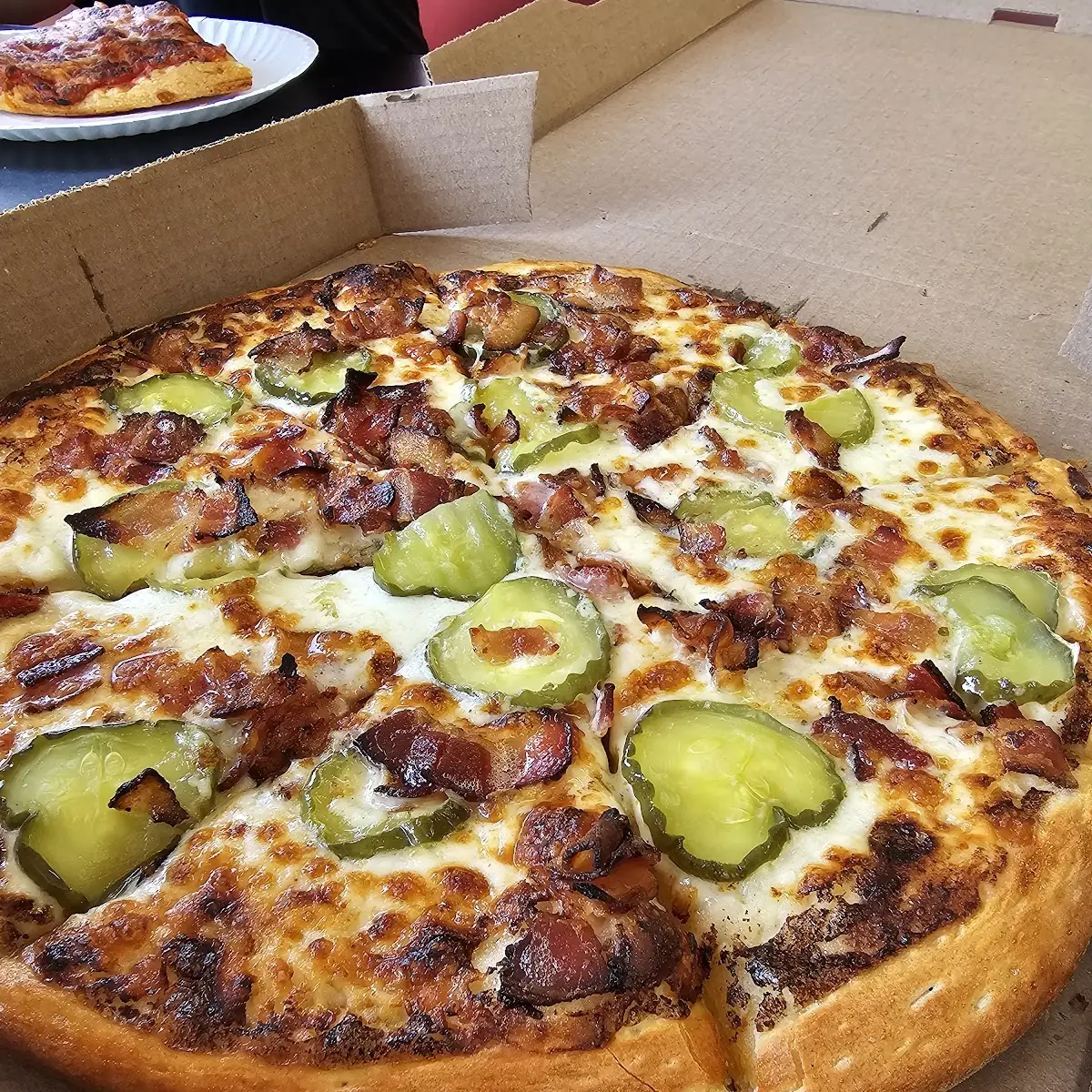 Pickle Bacon Ranch Pizza Cheese Pizza Slice in Background