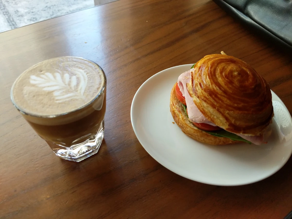 Cortado and a Ham Sandwich on Brioche Bread
