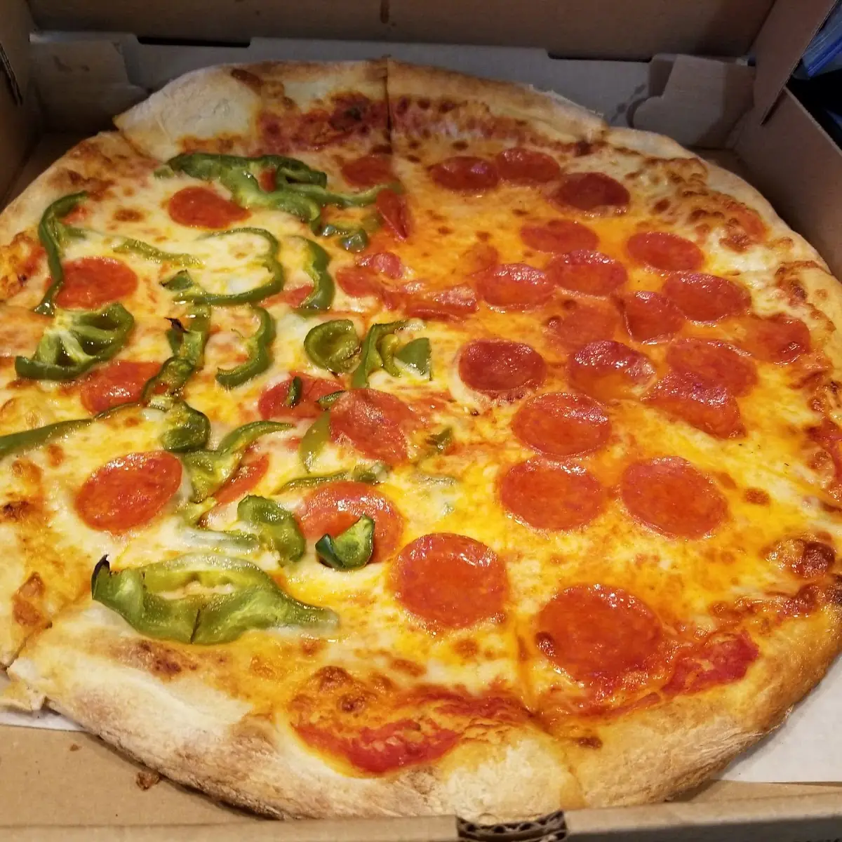 Pepperoni Pizza with Green Peppers on One Side