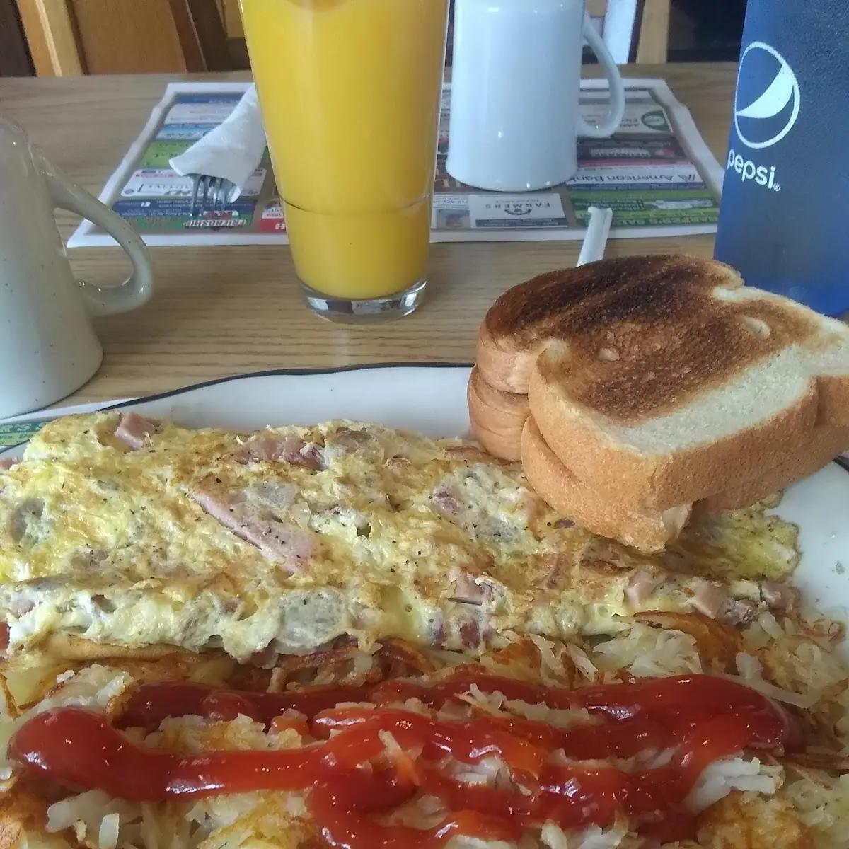 Meat-Lovers Omelette and Hash Browns