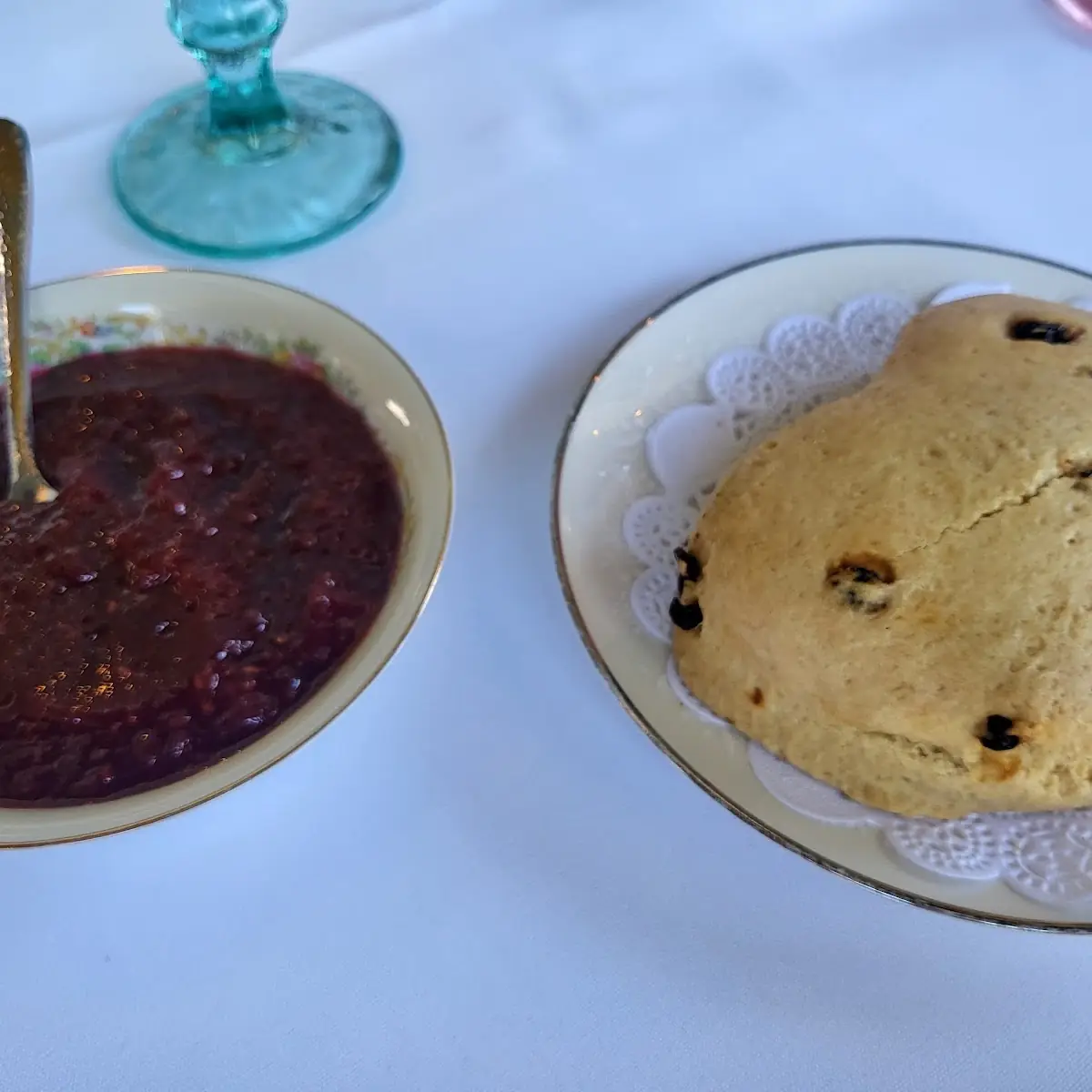 Freshly Baked Currant Scone with Raspberry Preserves and Early California Cream