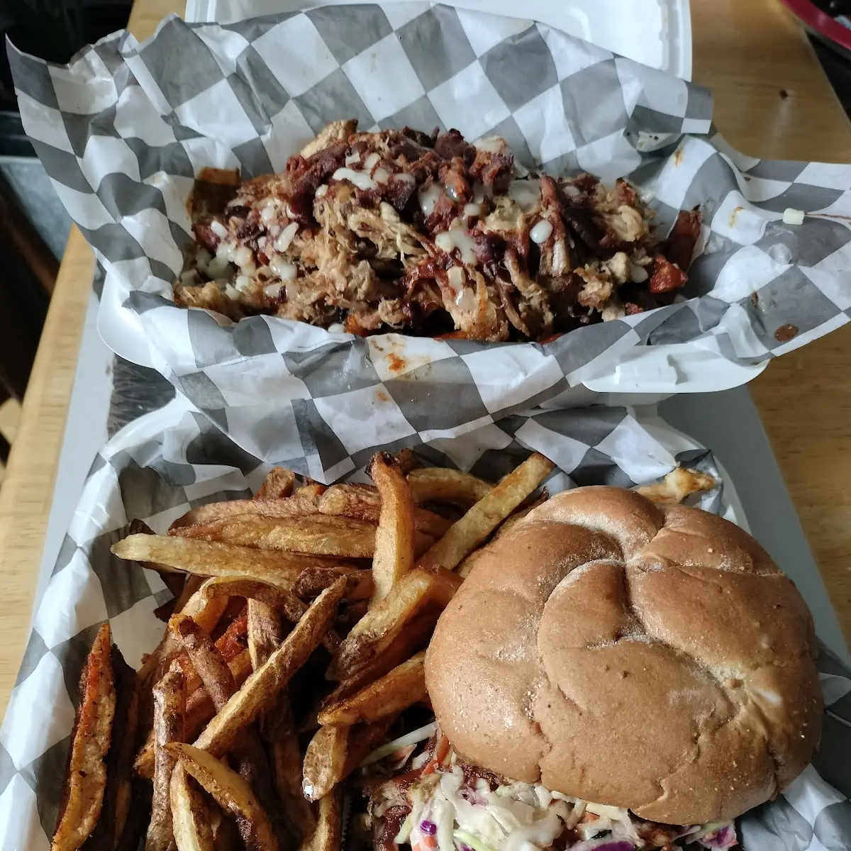 Pulled Pork Sandwich with the Grindstone Fries and Grindstone Loaded Pulled Pork with Everything