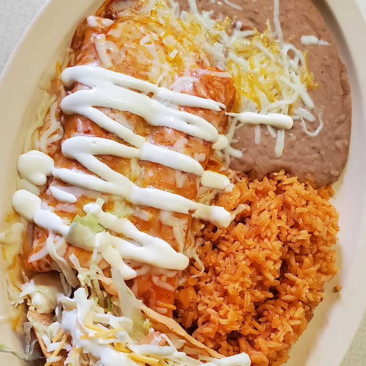 One Enchilada or Soft Taco with Rice