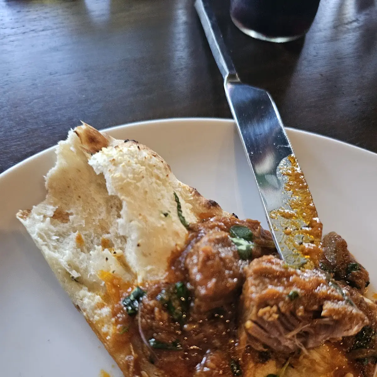 Garlic Naan with Lamb Curry on Top