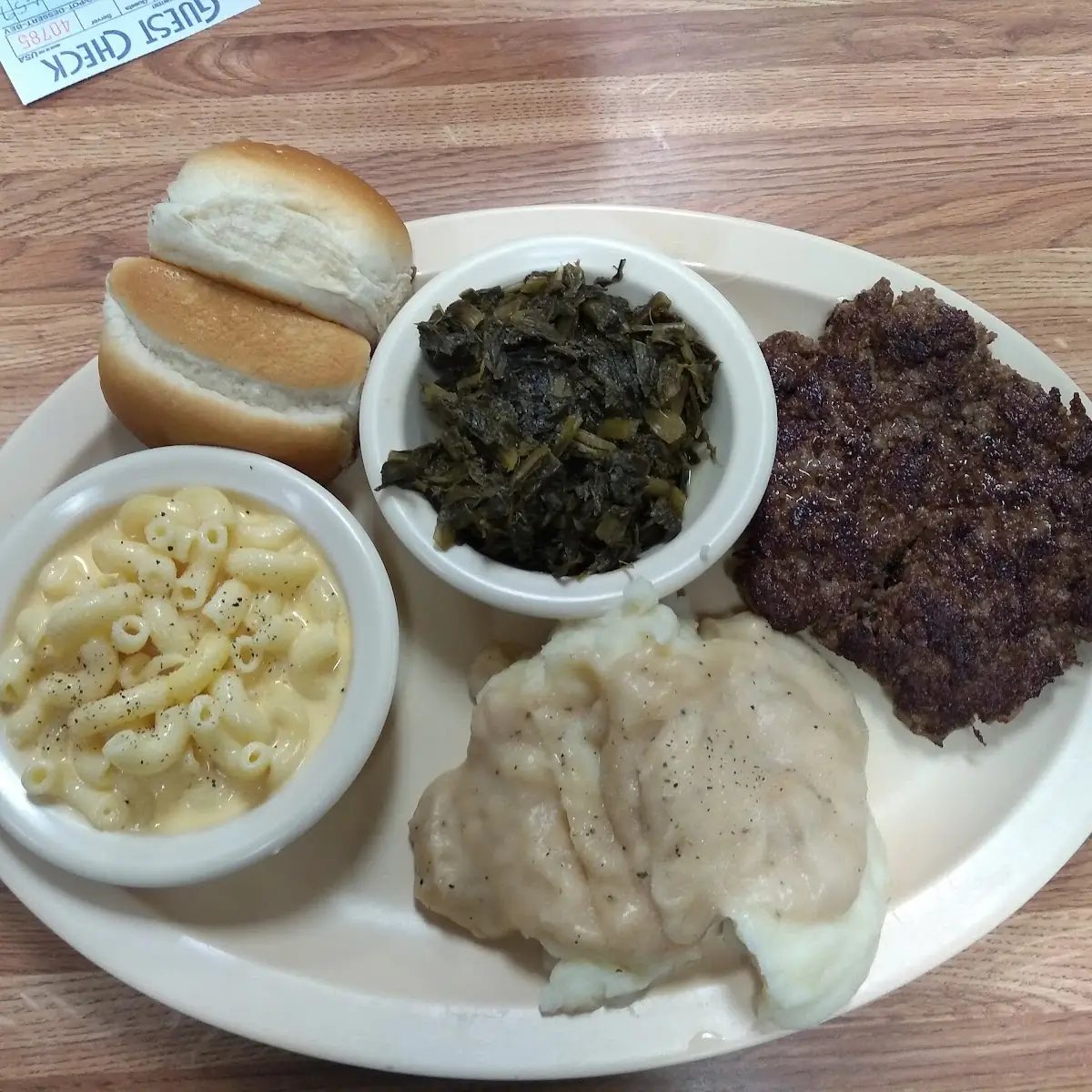 Hamburger Steak Turnip Greens Macaroni and Mashed Potatoes with Gravy