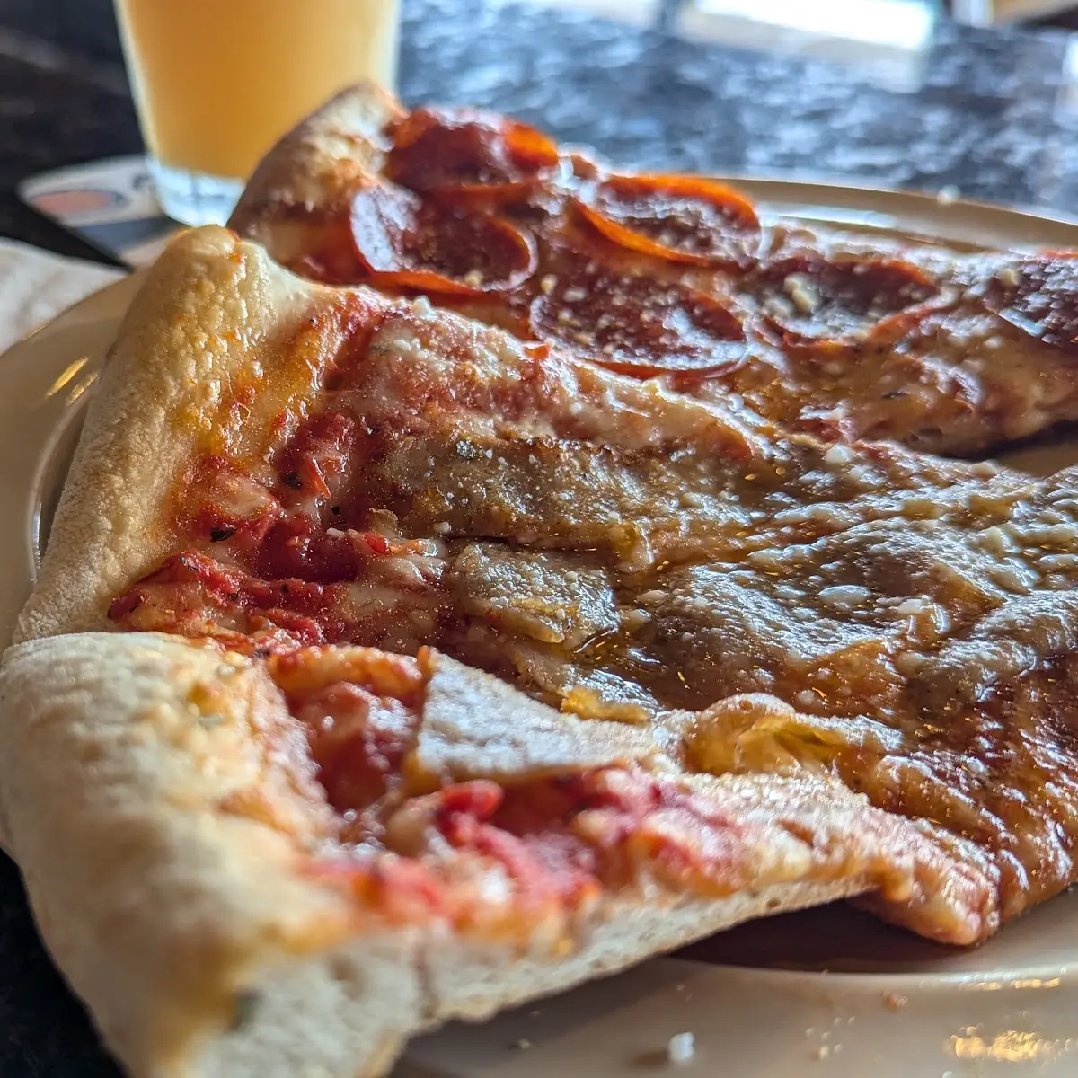 One Pepperoni Slice One Sausage Slice