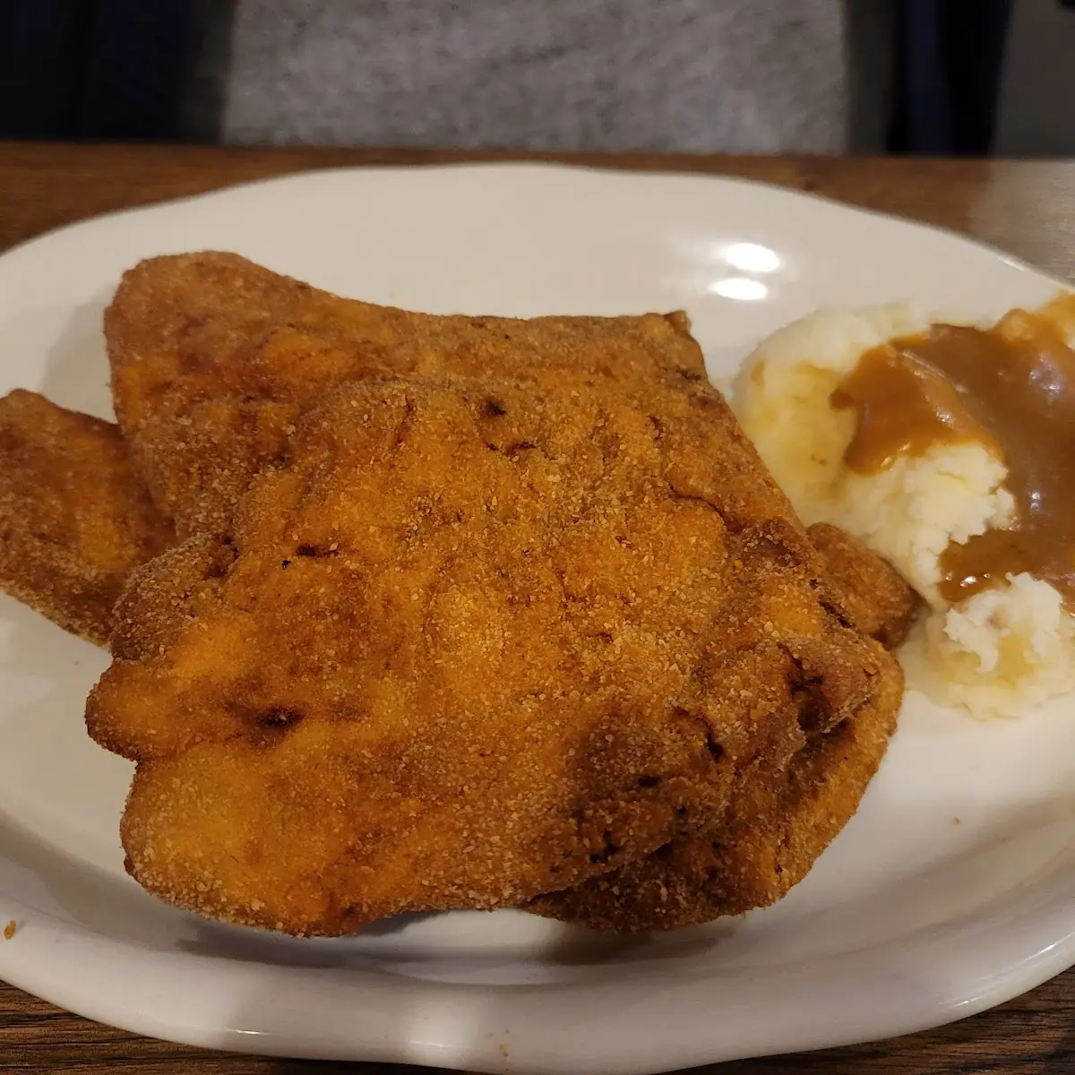 Two Eggs, Pork Chop, Potatoes, and Toast