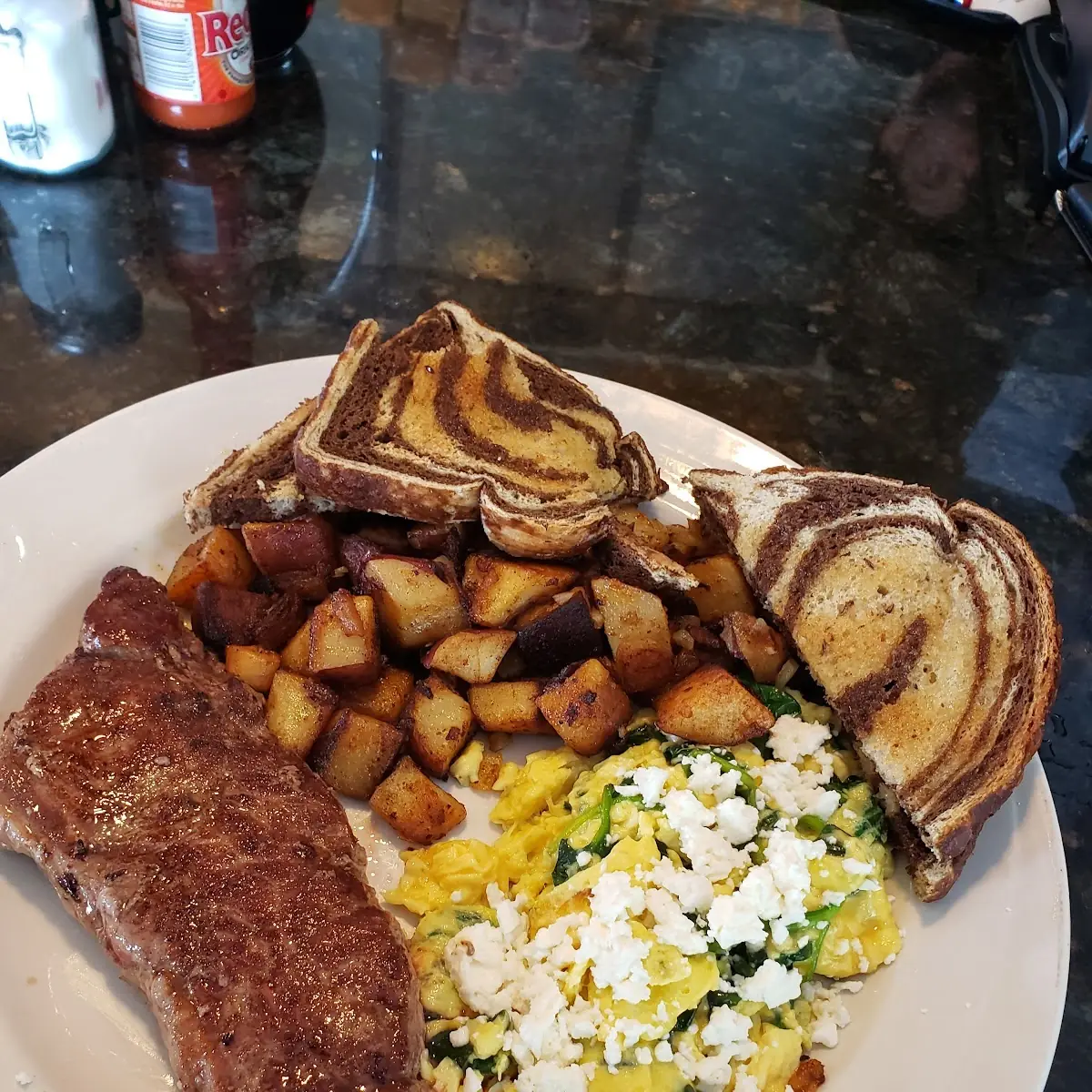 Steak & Eggs Plate 3 Eggs Any Style Served over Steak with Toast & Home Fries