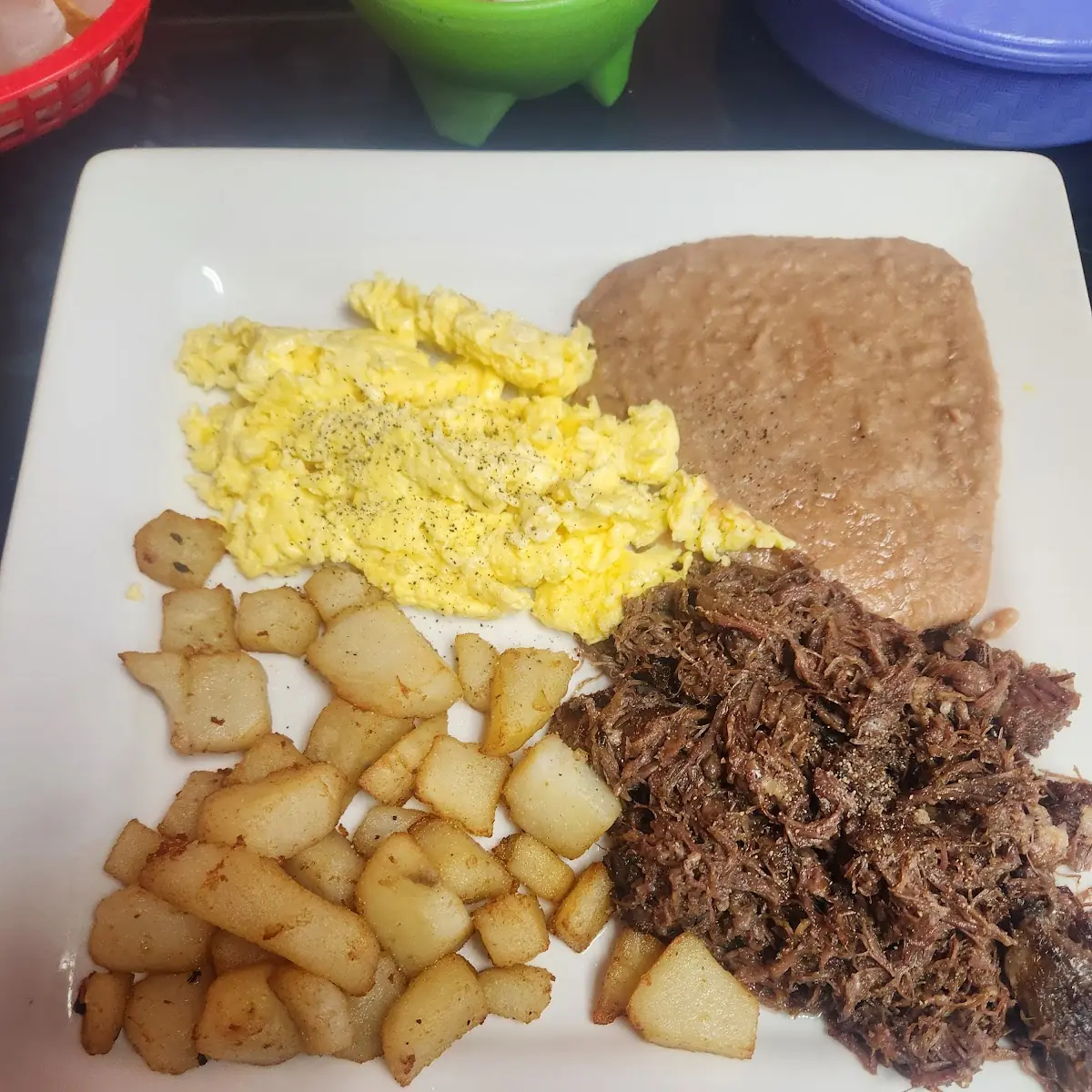 Eggs Potatoes Refried Beans and Barbacoa