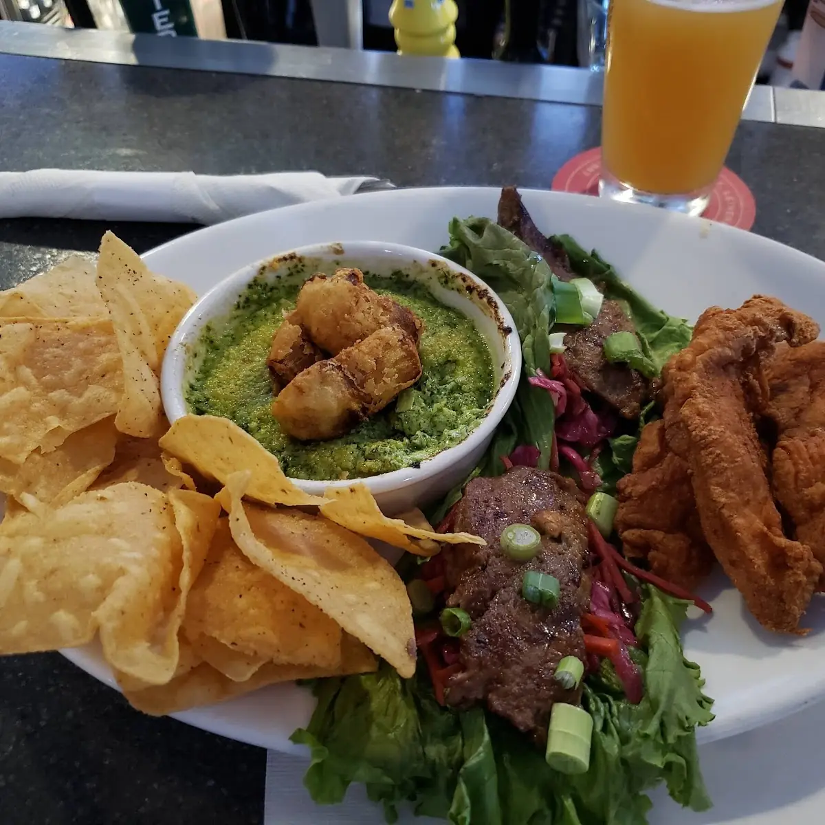 Appetizer Trio with Spinach Artichoke Dip Lettuce Wraps and Chicken Fingers