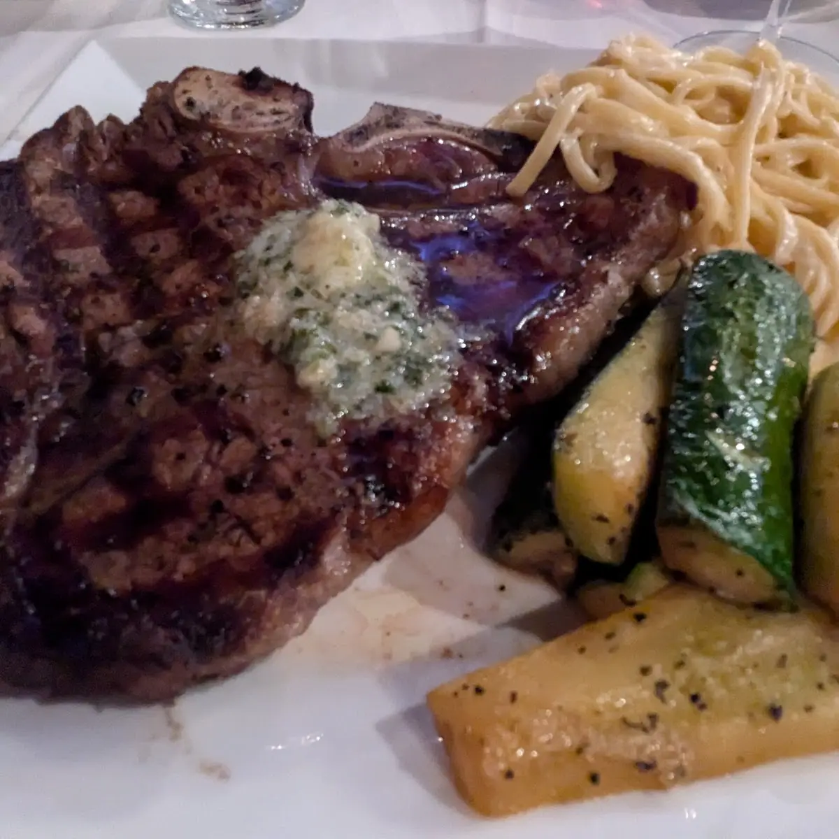 14oz T-Bone Steak Cooked with Garlic Butter