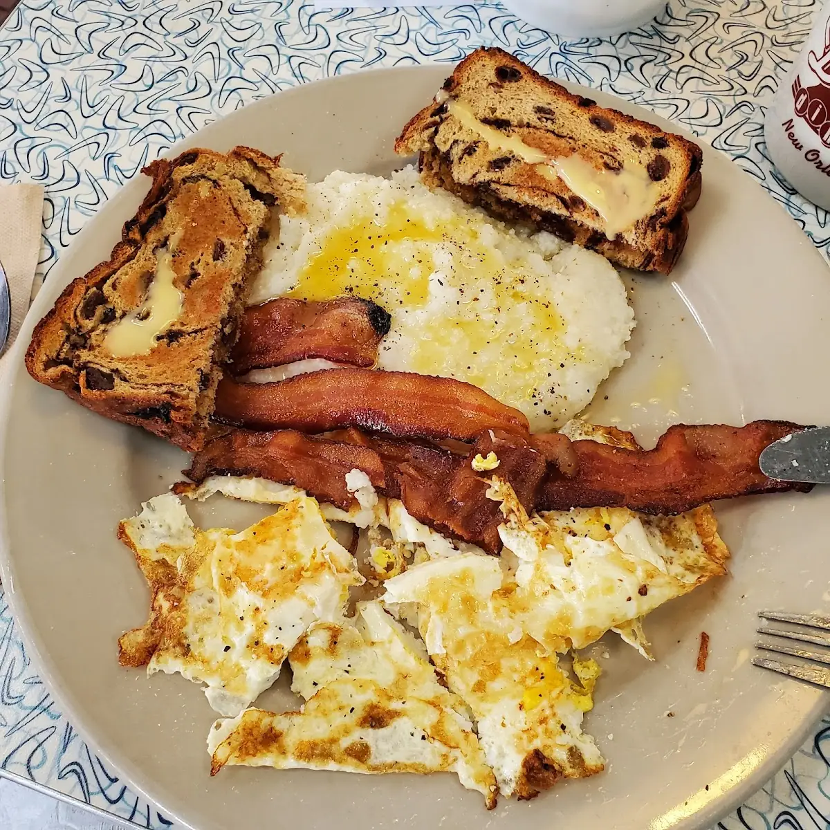 3 Eggs and Toast Bacon and Grits