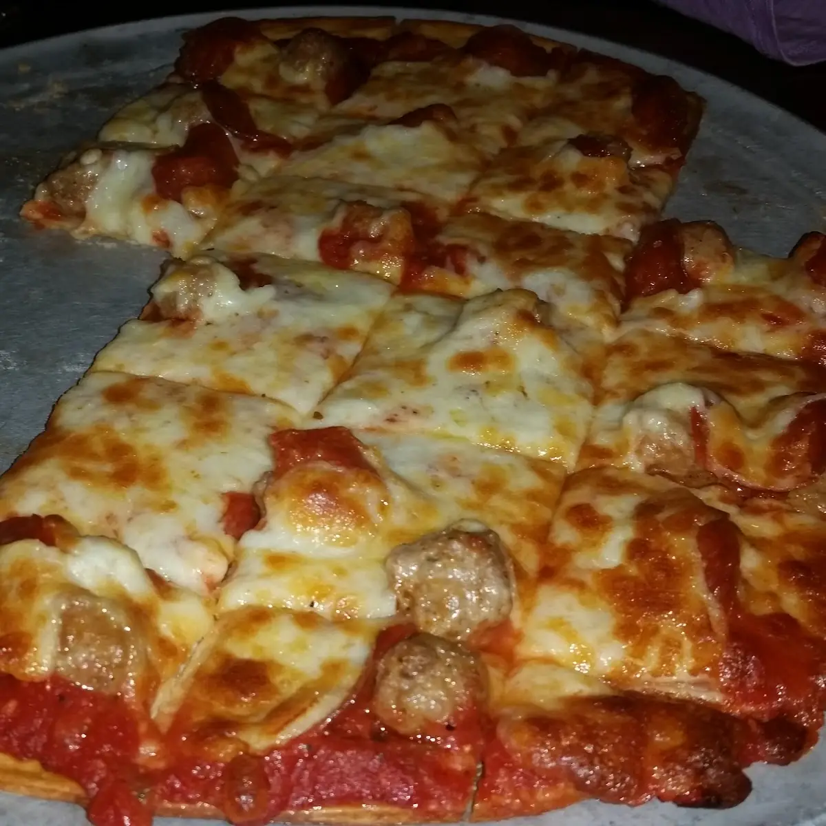 Thin Crust Pepperoni and Sausage Pizzain