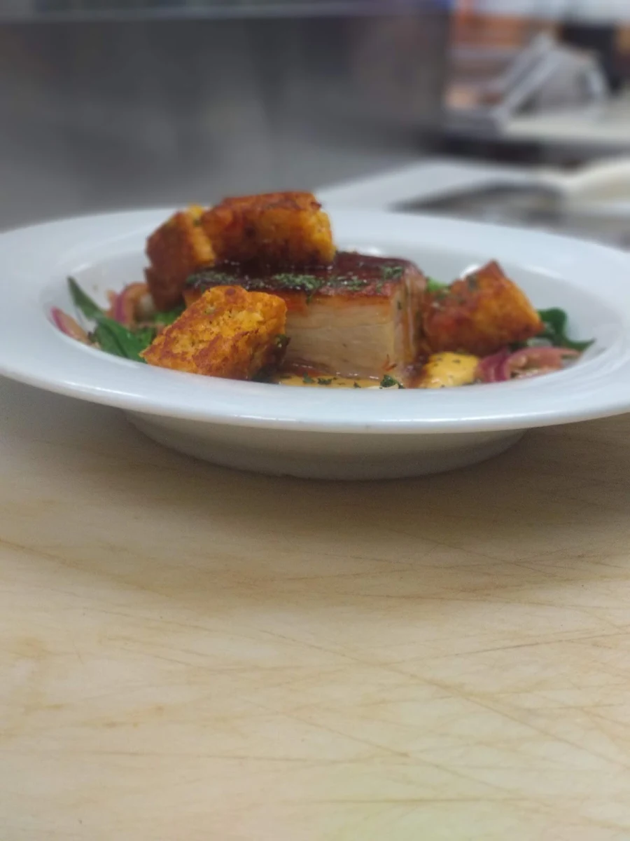 Pork Belly with Corn Bread Puree Broccolini and Corn Bread Croutons