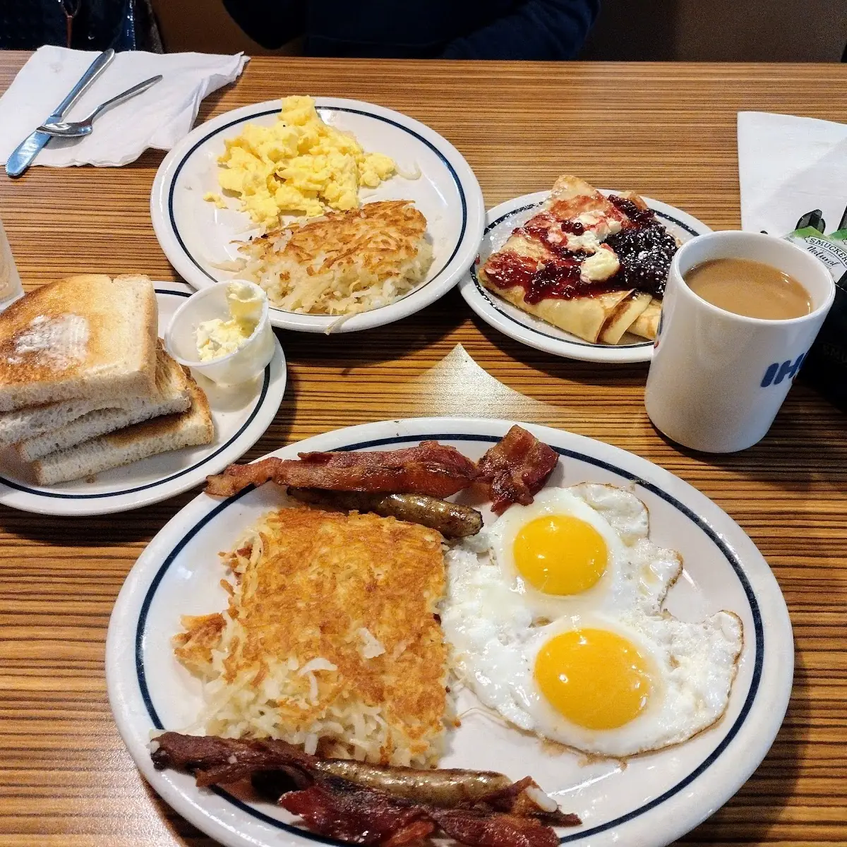 Two Eggs Two Bacon Strips Hash Brown and Pancakes