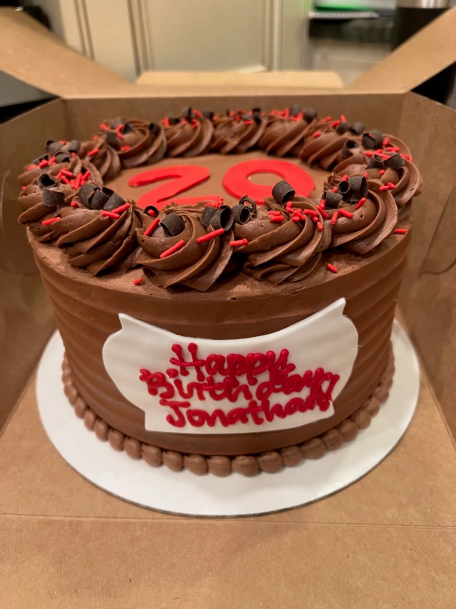 Custom Chocolate Cake with Chocolate Icing and Raspberry Filling