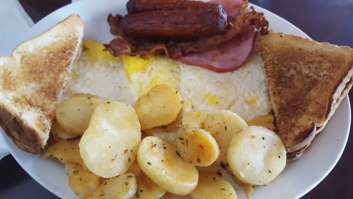 Scrambled eggs, home fries and toast