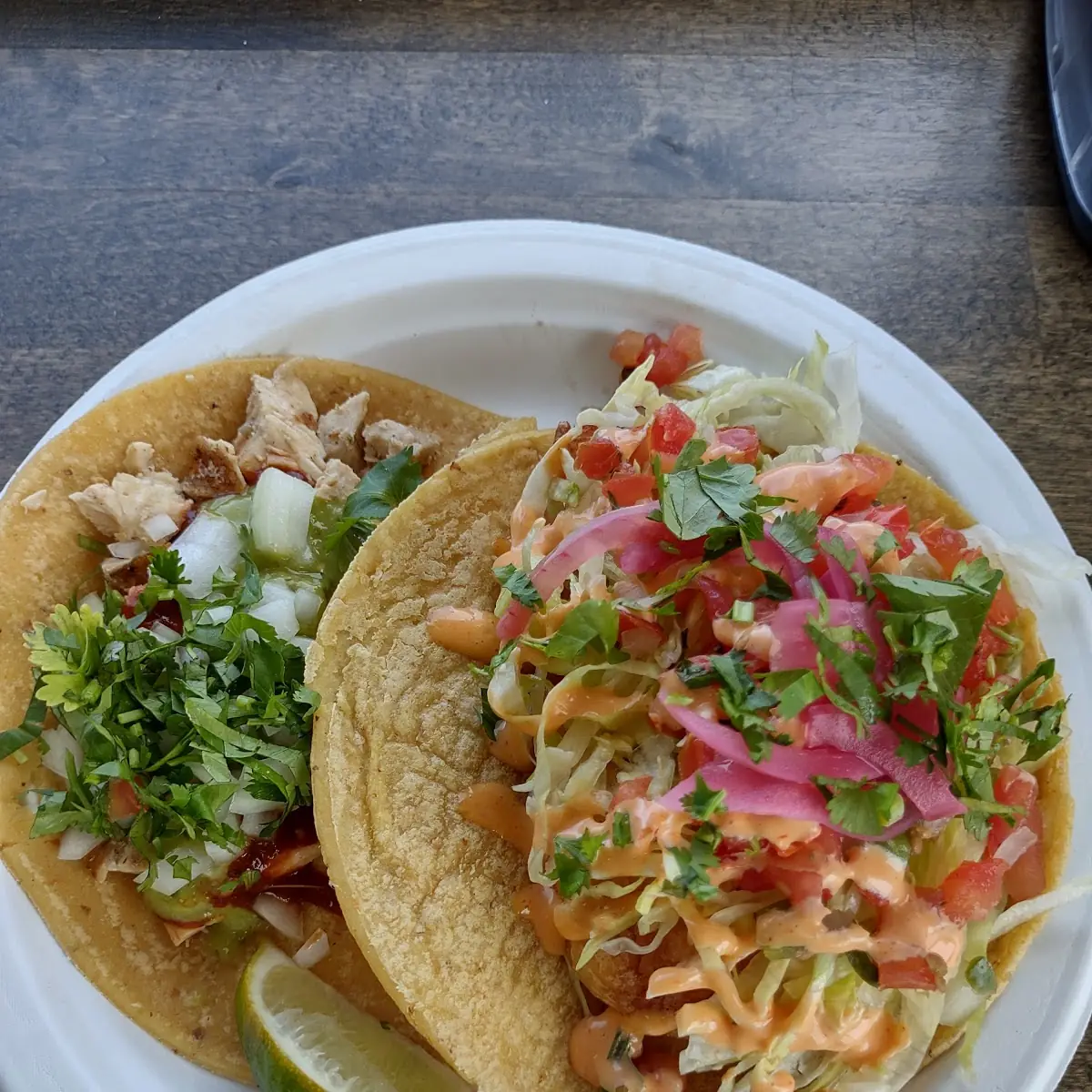 A Shrimp Taco and a Chicken Taco on Corn Tortillas