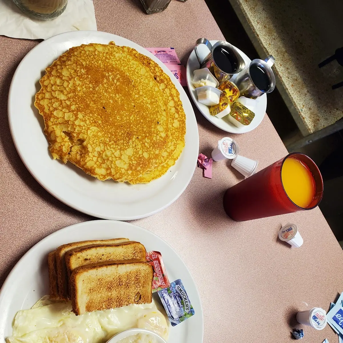 2 Eggs over Easy with Grits and Pancakes
