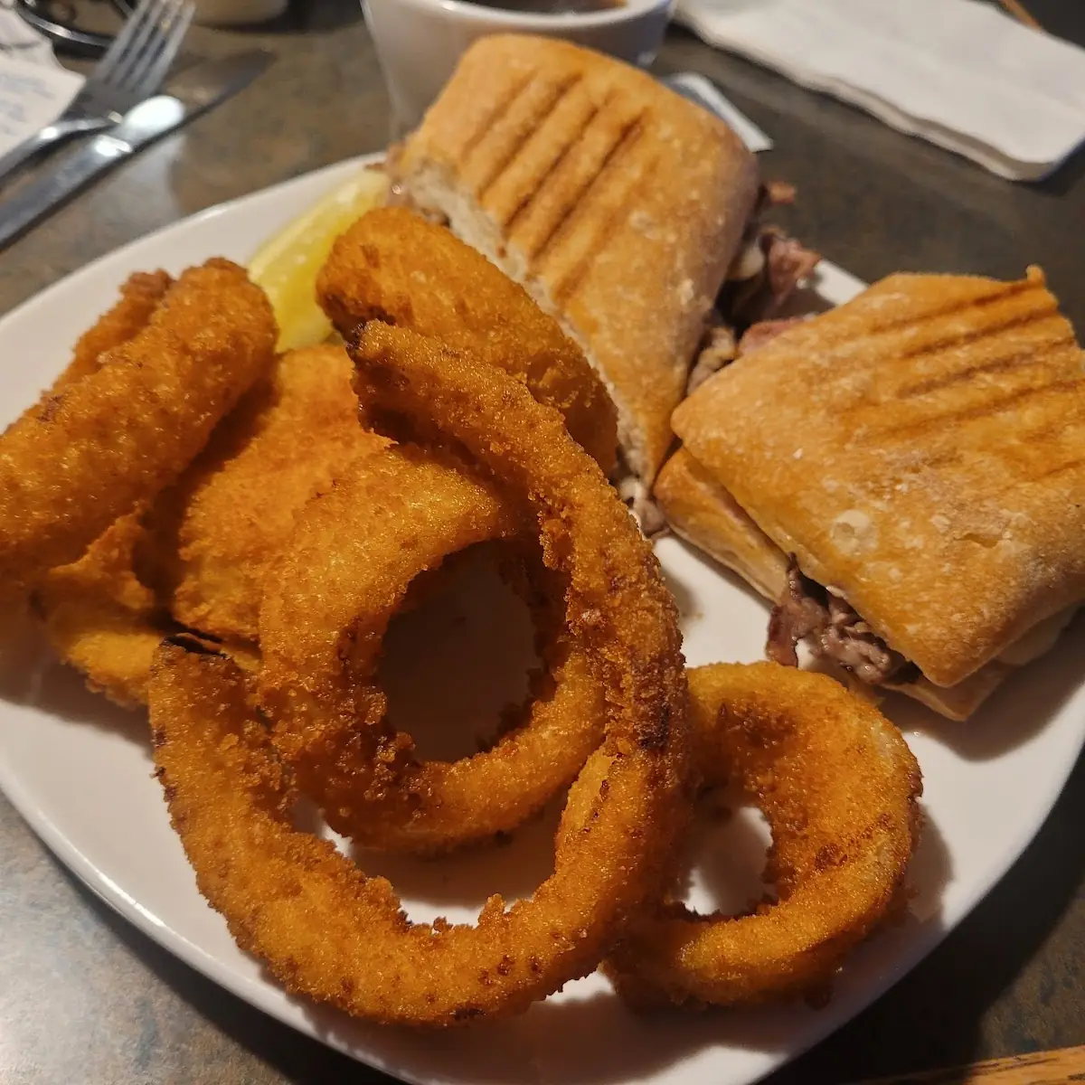 Prime Rib Pannini Sandwich with Onion Rings