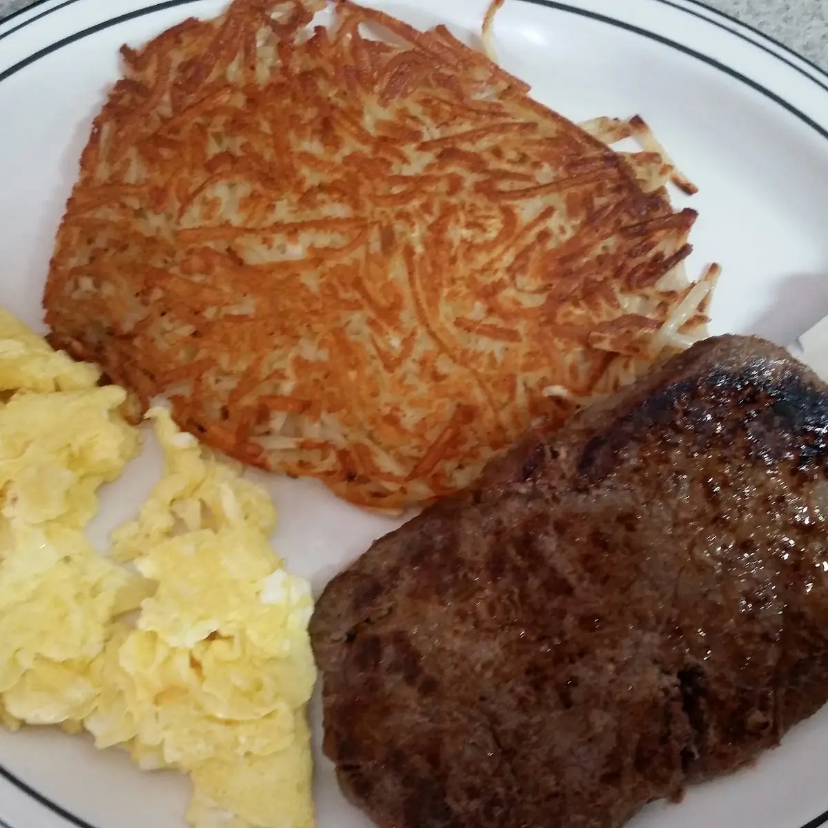 2 Eggs Ham Steak and Potatoes