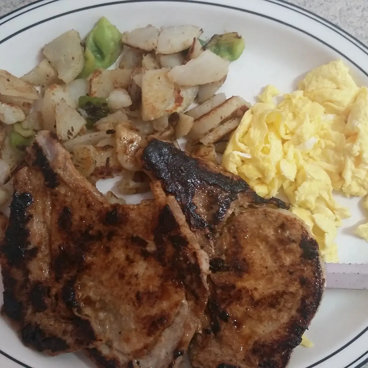 2 Eggs Pork Chops and Potatoes