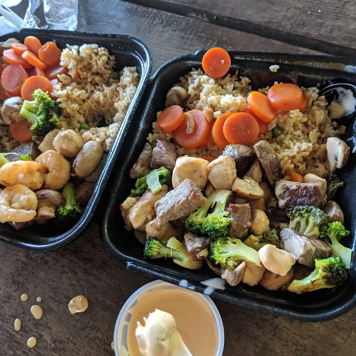 Chicken Shrimp and Steak Combo with Fried Rice Broccoli and Carrots
