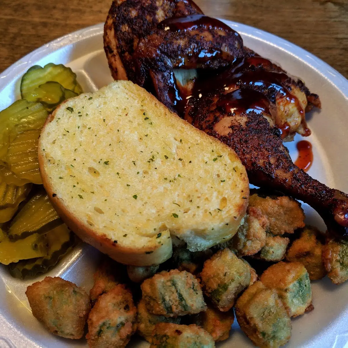 Half Chicken Fried Okra Sliced Pickles and Garlic Bread
