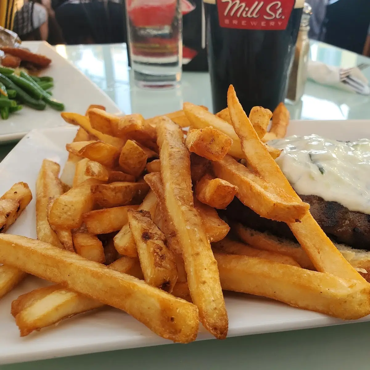 Lamb Burger with Tzatziki Sauce and Served with Fries, Corks Wine Bar & Eatery