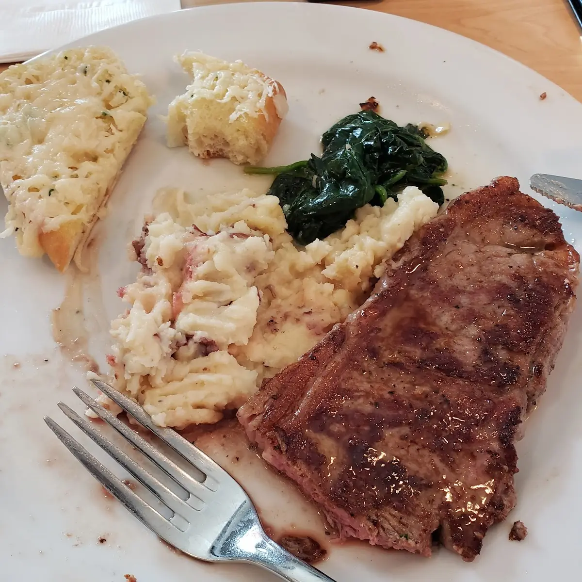 8oz New York Strip Steak Red Mashed Potatoes Spinach with Garlic Cheese Bread