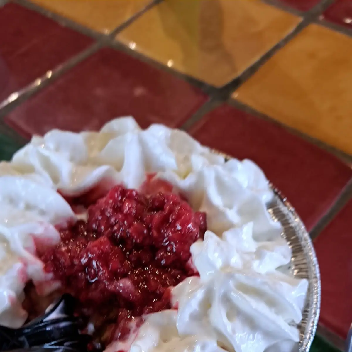 Bread Pudding with Raspberry Sauce and Whipped Cream