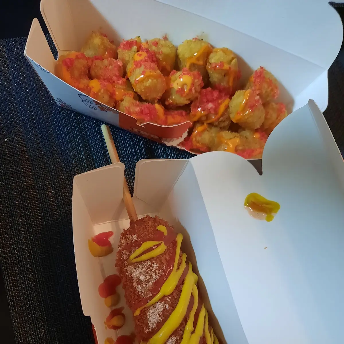 Two Hands Corn Dog and Fries
