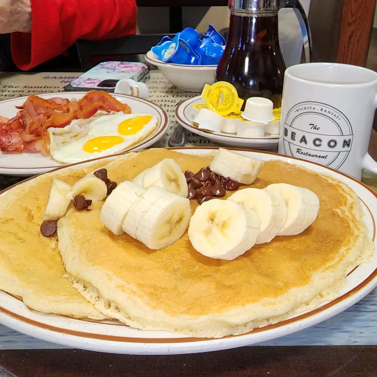 Banana & Chocolate Chip Short Stack with Bacon and Eggs