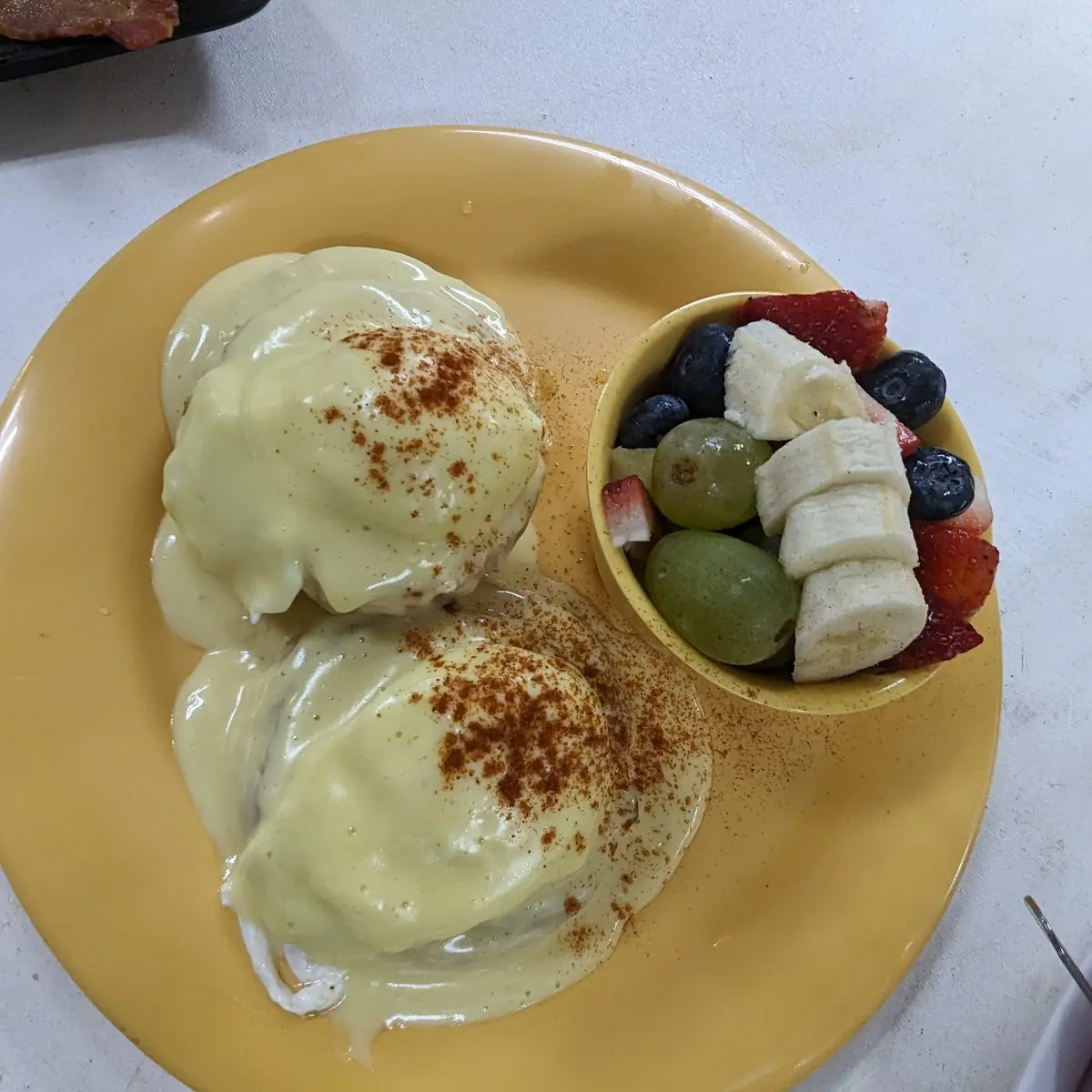 Eggs Benedict and Fruit Cup