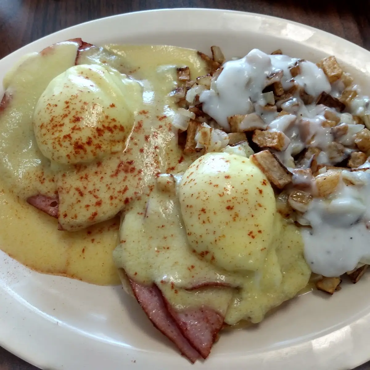 Eggs Benedict with Home Fries Smothered and Covered