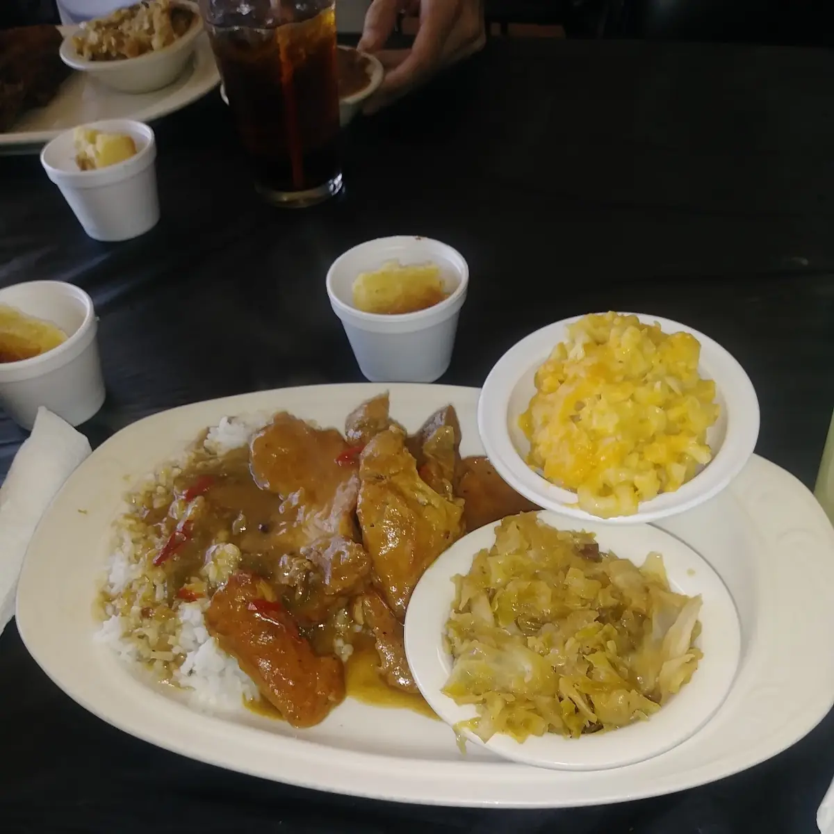 Smothered Pork Chops Cabbage Mac Cheese and Complimentary Pineapple Upside Down Cake