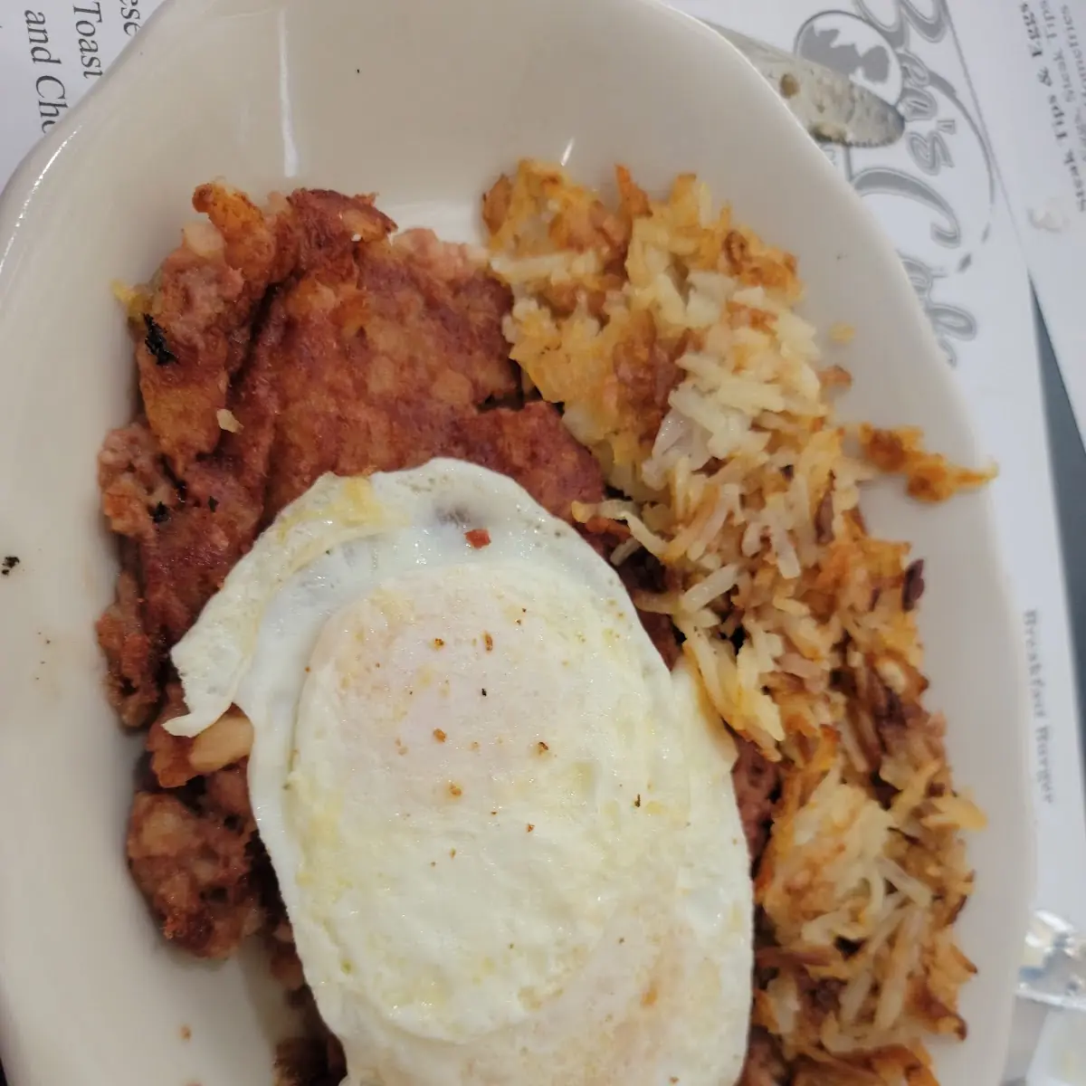 Corned Beef Hash over Easy Eggs and Home Fries