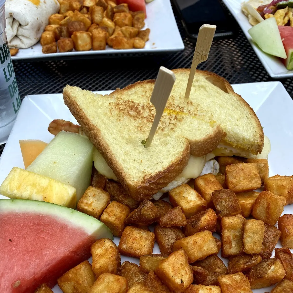 Breakfast Sandwich with Hashbrowns and Fruit