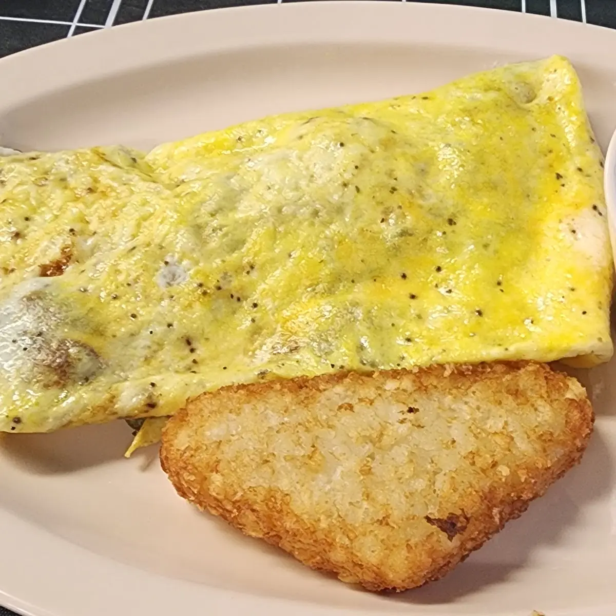 Everything Omelet Te Hash Brown Grits