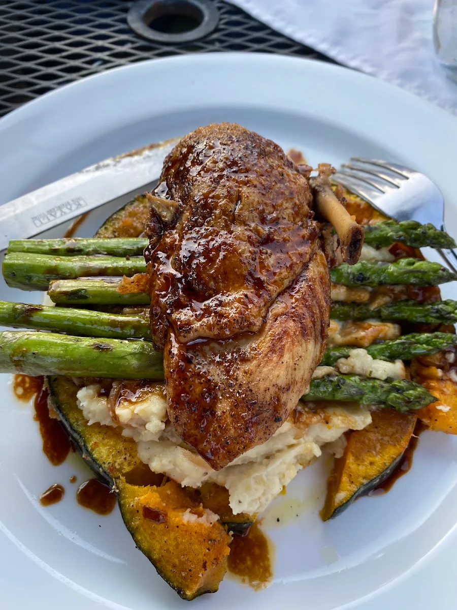 Confit Chicken on Mashed Potatoes Asparagus and Summer Swuash