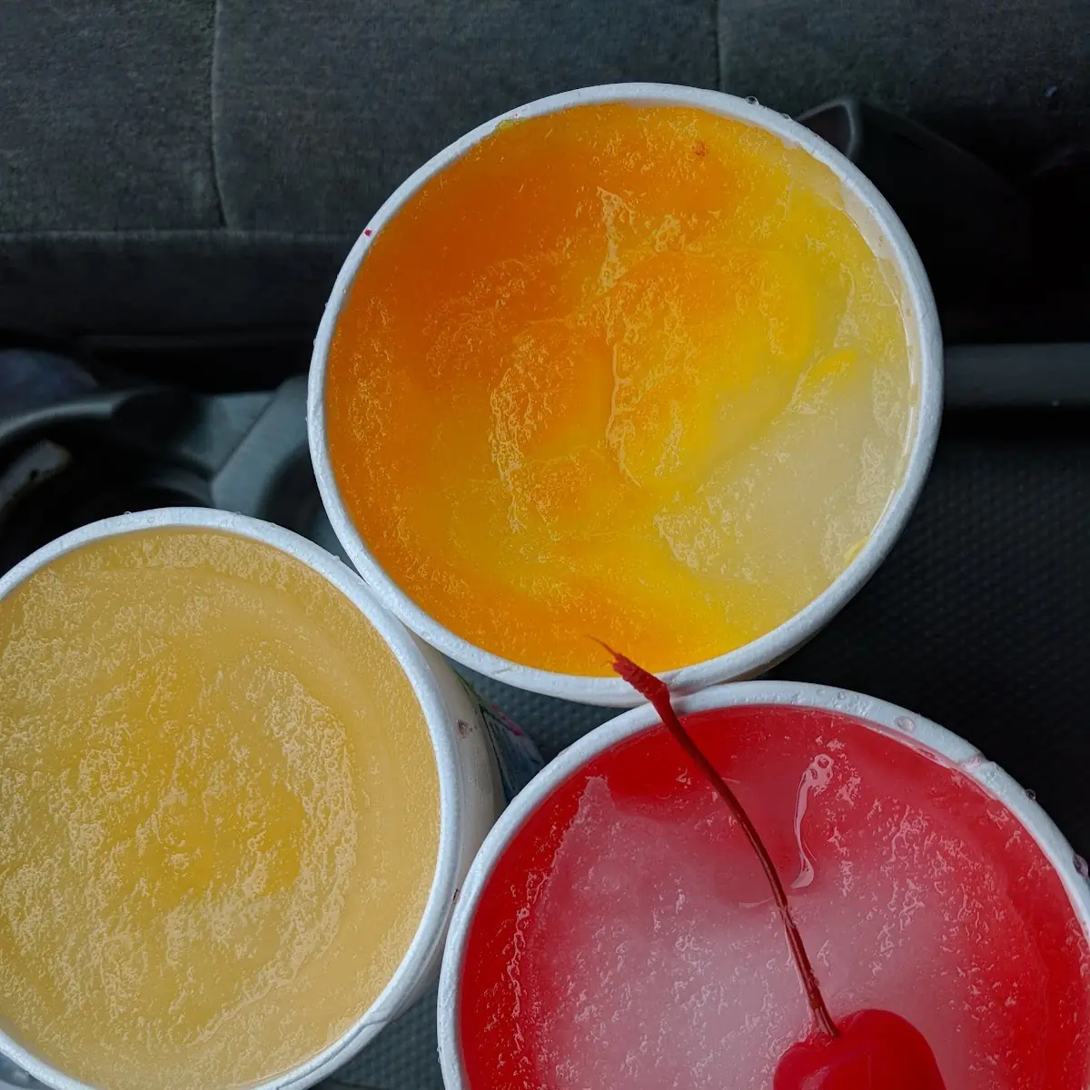 Happy Hour Slushes Orange Mango and Cherry