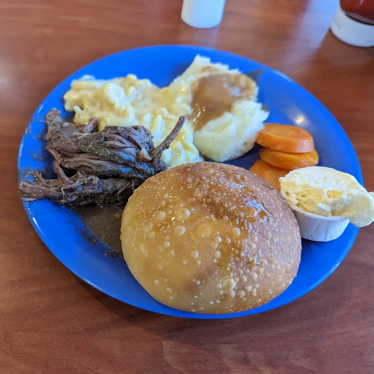 Pot Roast with Carrots Mashed Potatoes and a Roll
