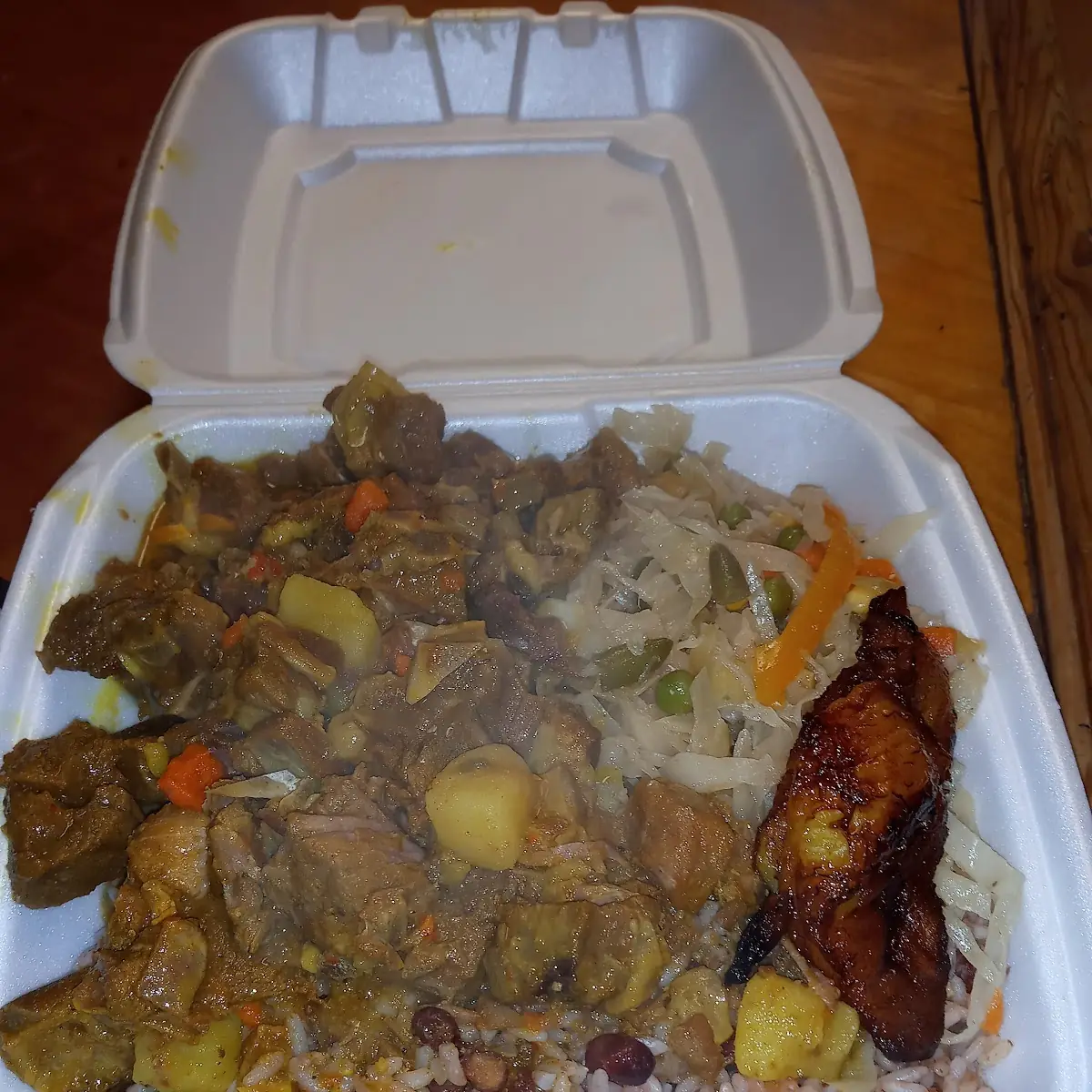 Curry Goat over Rice with Vegetables
