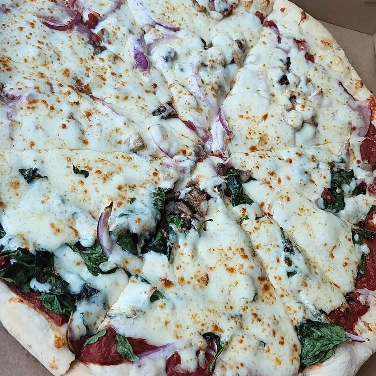 Custom Pizza Half Canadian Bacon Half Spinach Whole Mushrooms and Red Onions
