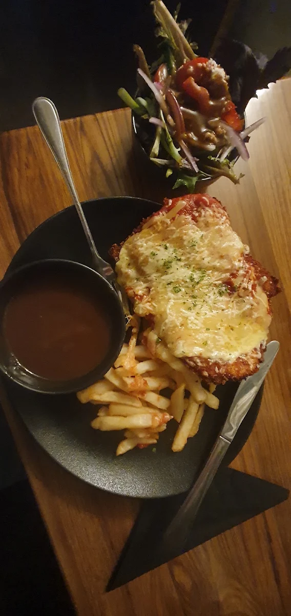 Chicken Parmigiana with Chips Greek Salad and Gravy, Top Pub