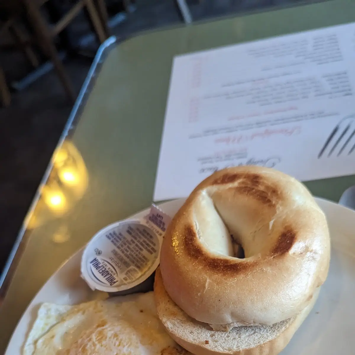 Bagel with Cream Cheese and Two Eggs over Easy