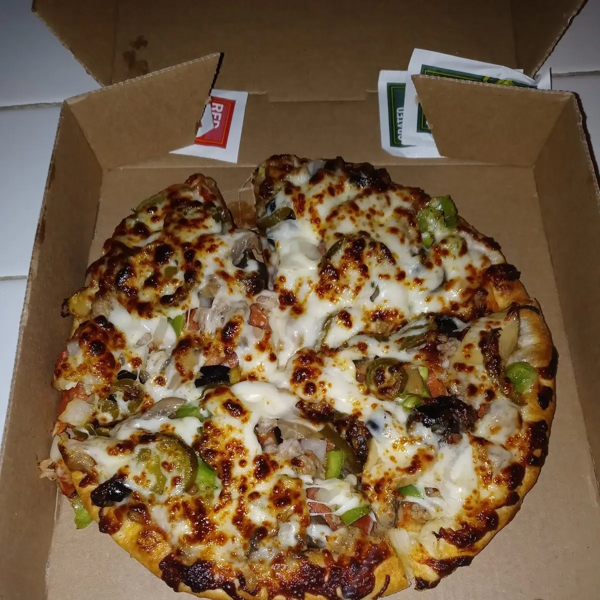 Personal Pan Supreme Pizza and Added Jalapeño's