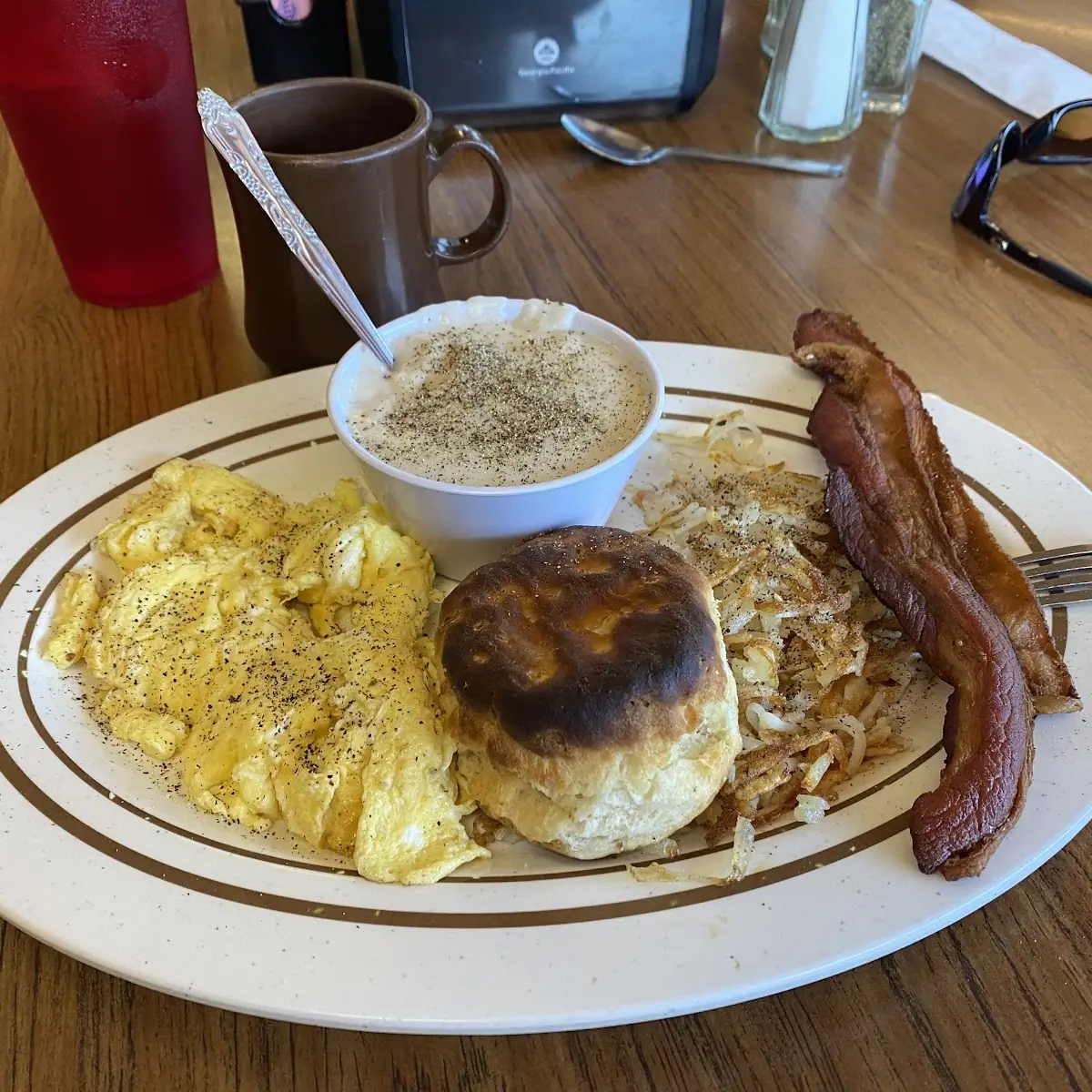 Two Scrambled Bacon Crispy Hash Browns and Homemade Biskit with Gravy
